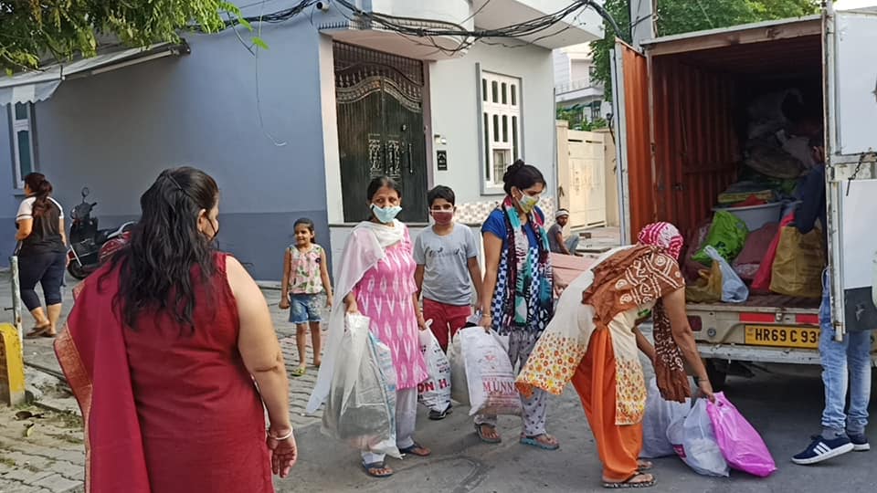Women loading donated items into a ngo truck